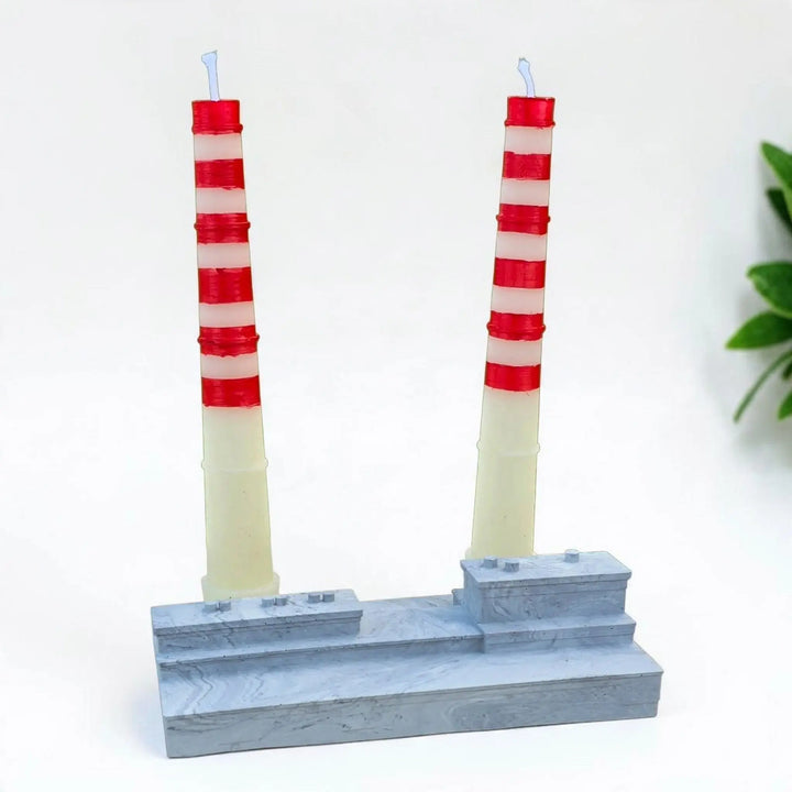 Poolbeg candle set: two red and white striped chimney candles in a grey stone effect base