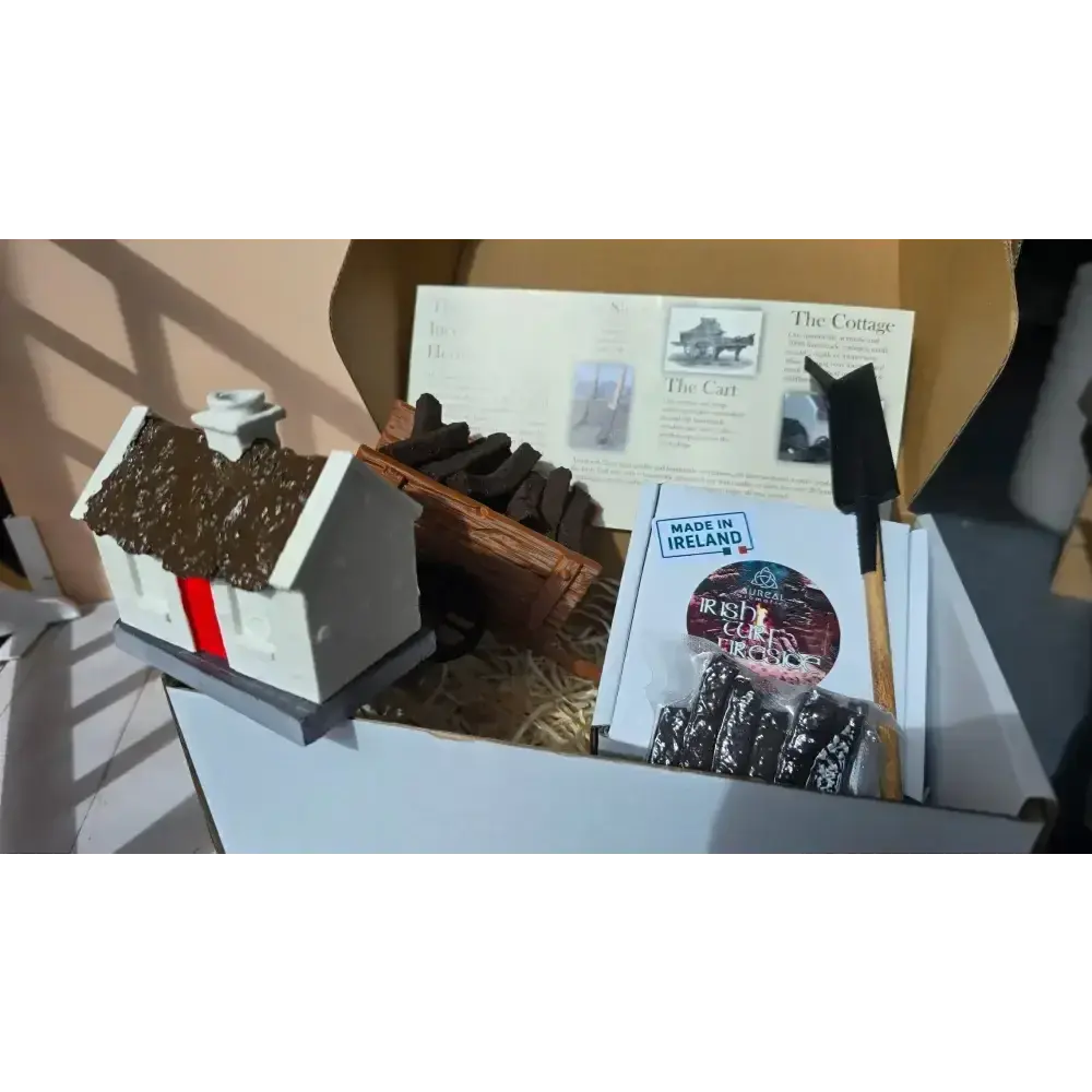 Heritage set box packed with the cottage burner, turf cart, sleán, info sheet and a turf pack