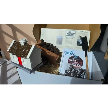 Heritage set box packed with the cottage burner, turf cart, sleán, info sheet and a turf pack